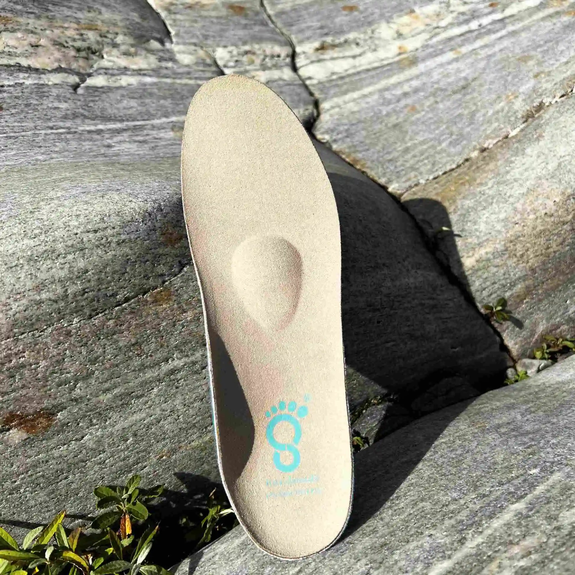 CC Everyday insole in front of stone